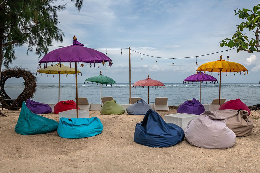 Colorful Beach Umbrellas and Bean Bags, Gili Islands, Indonesia art print by Richard Silver for $57.95 CAD