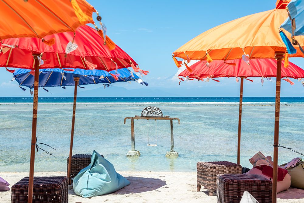 Red and Orange Beach Umbrellas with Swing, Gili Islands, Indonesia art print by Richard Silver for $57.95 CAD