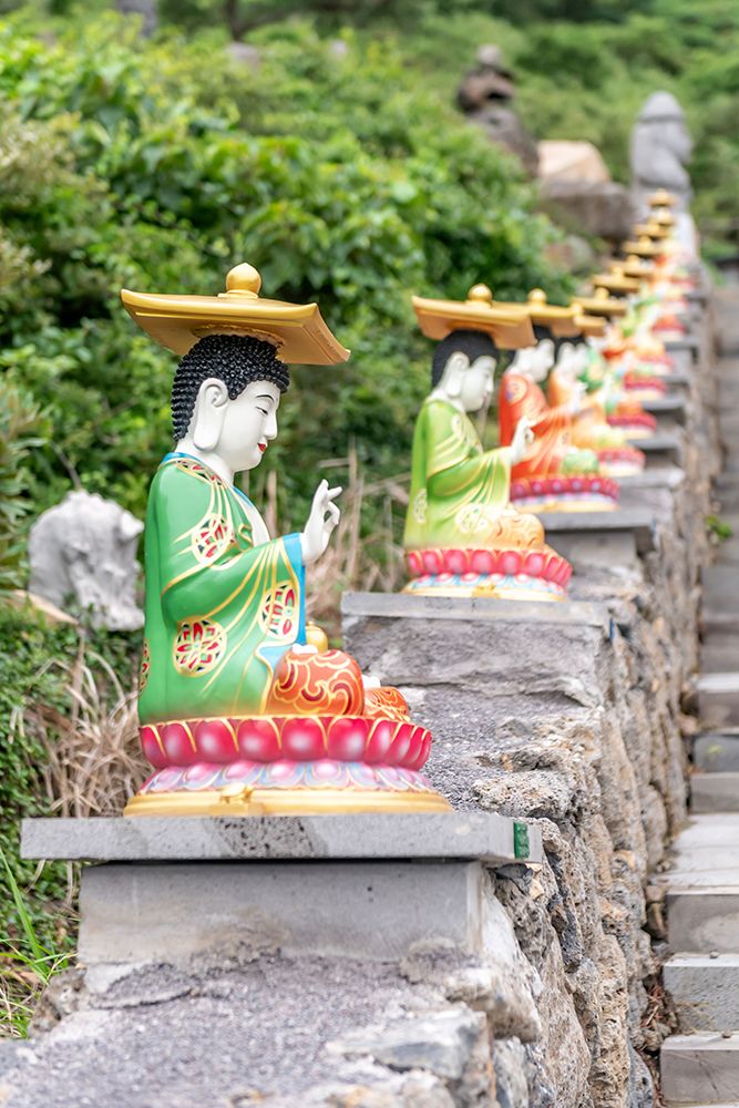 Row of Colorful Buddha Statues on Temple Steps, Jeju Island, South Korea art print by Richard Silver for $57.95 CAD