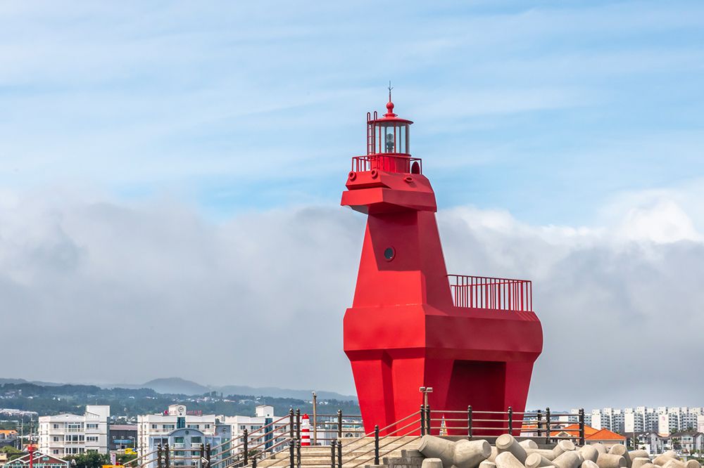 Red Horse-Shaped Lighthouse on Rocky Jetty, Jeju Island, South Korea art print by Richard Silver for $57.95 CAD