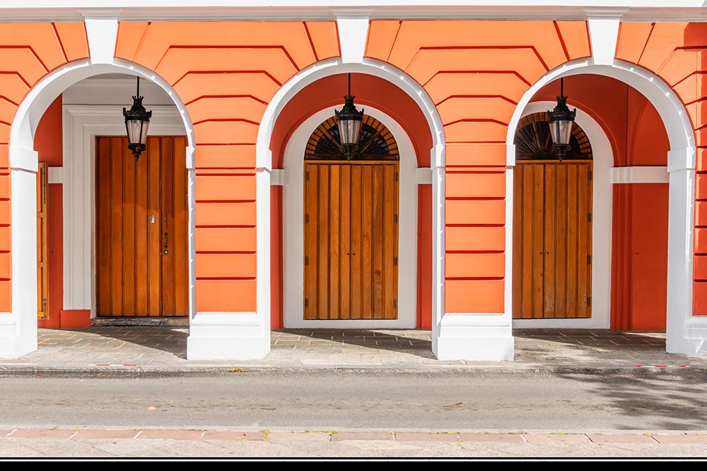 Orange Colonial Facade with Arched Wooden Doors art print by Richard Silver for $57.95 CAD
