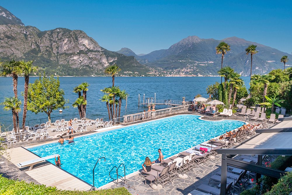 Lakeside Resort Pool with Mountain View, Lake Como, Italy art print by Richard Silver for $57.95 CAD