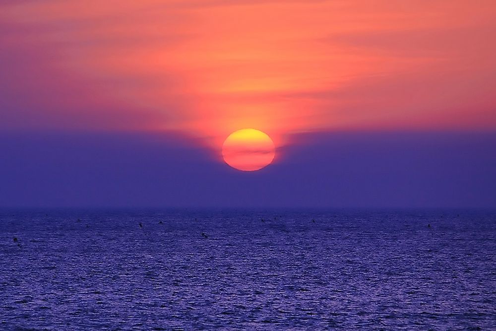 Sunset over the Ocean art print by Artographie for $57.95 CAD