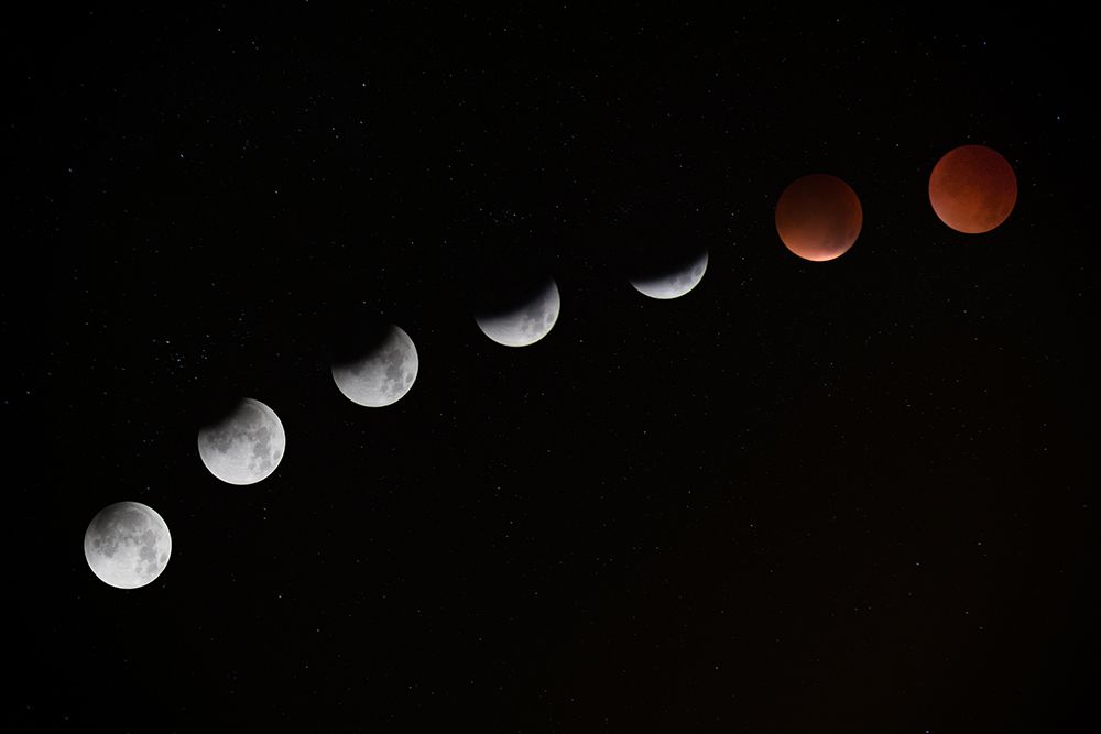 The Moon Turning Red during a Lunar Eclipse at Telscombe Cliffs art print by NASA for $57.95 CAD