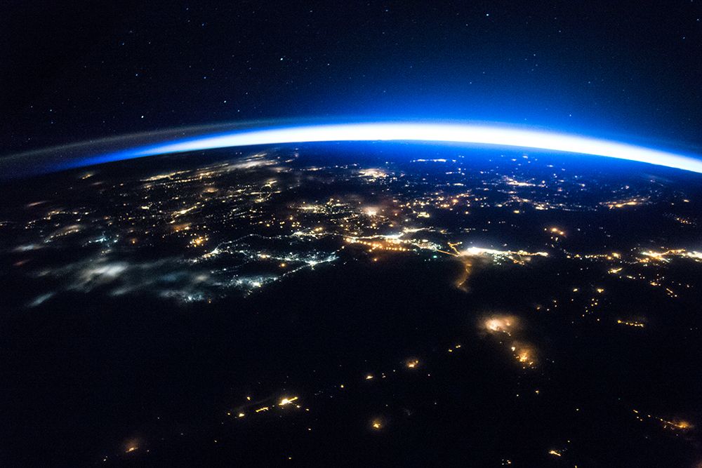Night image of a Sliver of Daylight Framing the Northern Hemisphere art print by NASA for $57.95 CAD