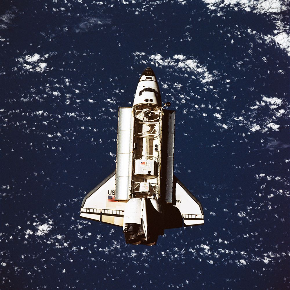 The Space Shuttle Discovery approaches Russias Mir Space Station art print by NASA for $57.95 CAD